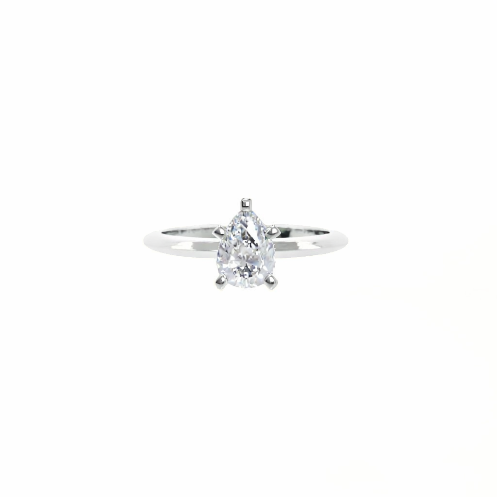 Diamond ring with a pear-shaped center stone on a white background