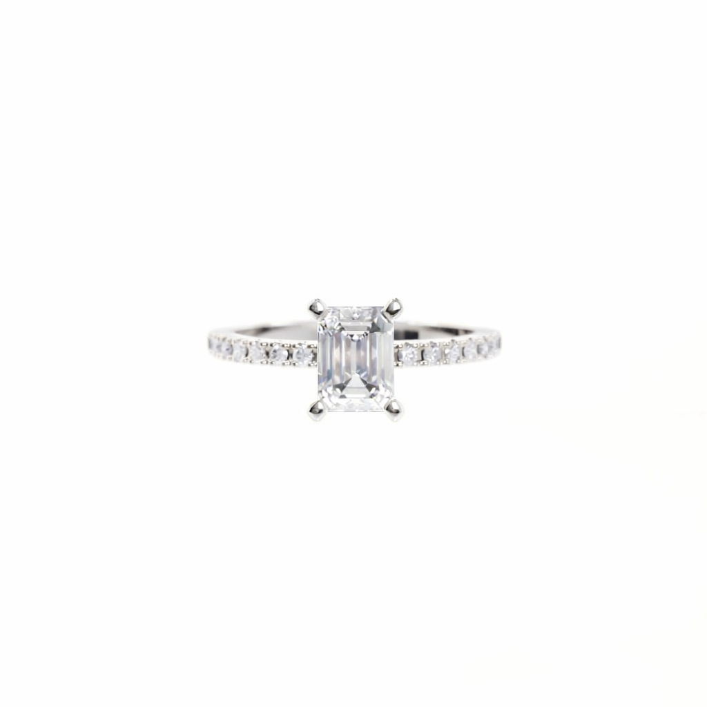 Diamond ring with a rectangular center stone on a white background