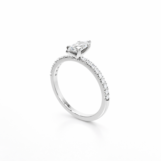 Silver ring with a diamond on a white background