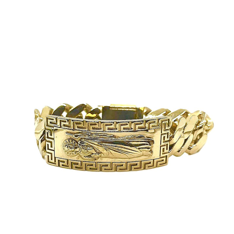 Gold bracelet with intricate design on a white background