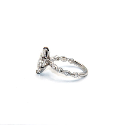 Silver ring with diamonds on a white background