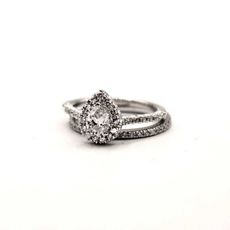 Silver ring with a diamond on a white background