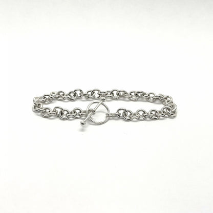 Silver chain bracelet with a clasp on a white background