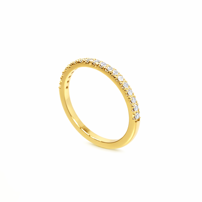 Gold ring with small diamonds on a white background