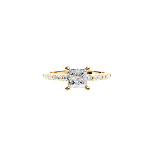Gold ring with a central diamond and smaller diamonds on the band against a white background