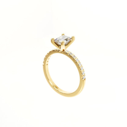 Gold ring with a diamond on a white background