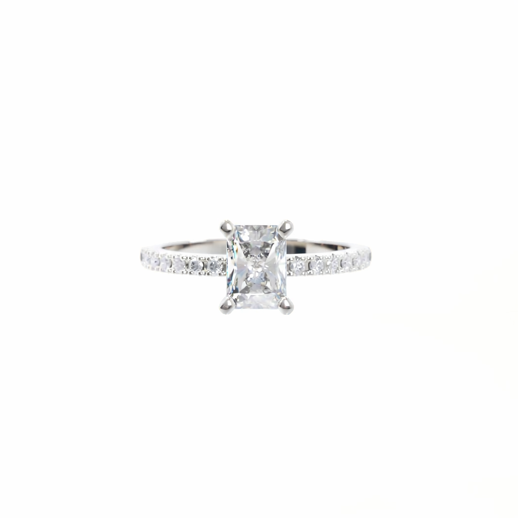 Diamond ring with a central princess-cut diamond and smaller diamonds on the band against a white background