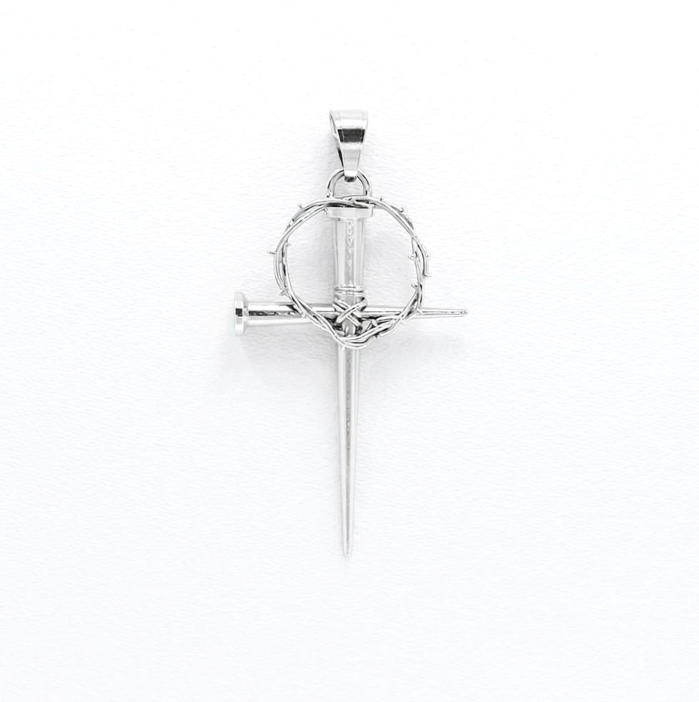 Silver cross pendant with a circular design on a white background
