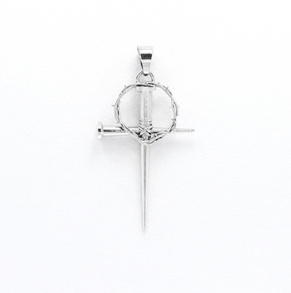 Silver cross pendant with a circular design on a white background