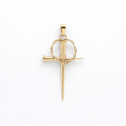 Gold pendant with a nail design on a white background