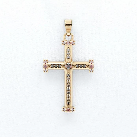Gold cross pendant with embedded stones on a white background