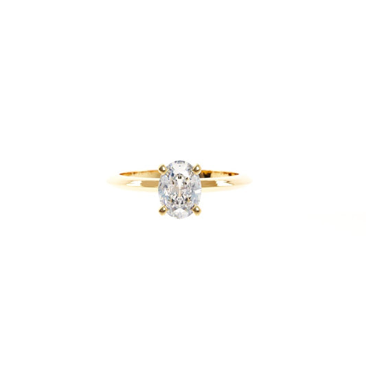 Gold ring with a diamond on a white background