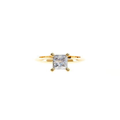 Gold ring with a diamond on a white background