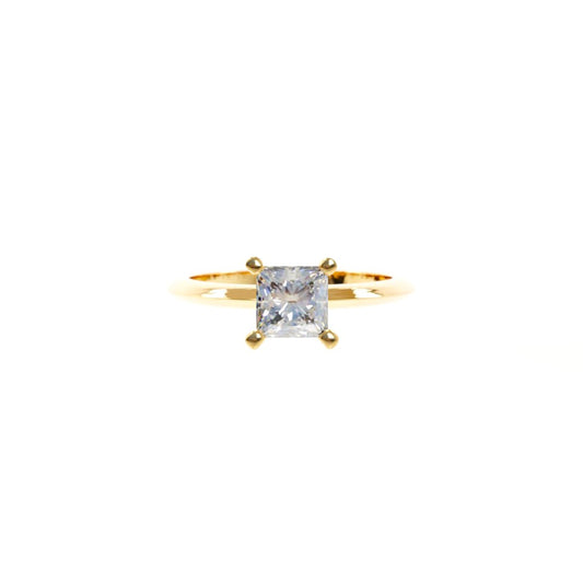 Gold ring with a diamond on a white background
