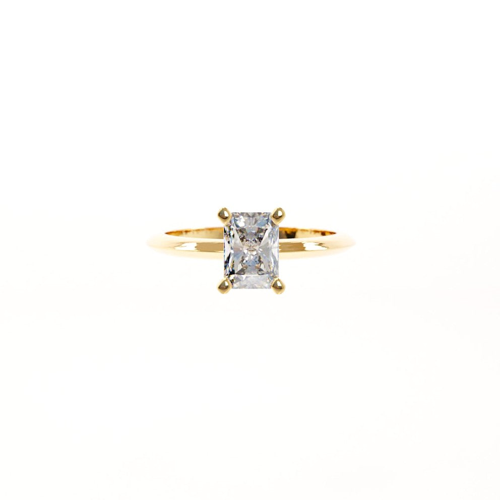 Gold ring with a diamond on a white background
