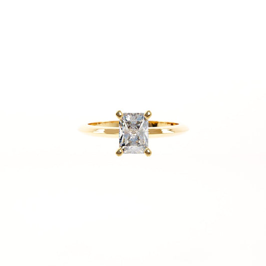 Gold ring with a diamond on a white background