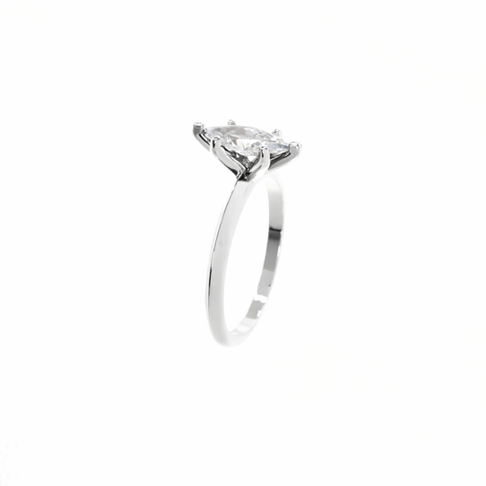 Silver ring with a diamond on a white background