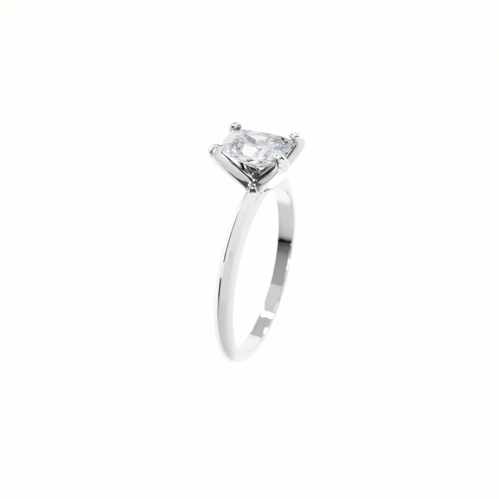 Silver ring with a clear gemstone on a white background