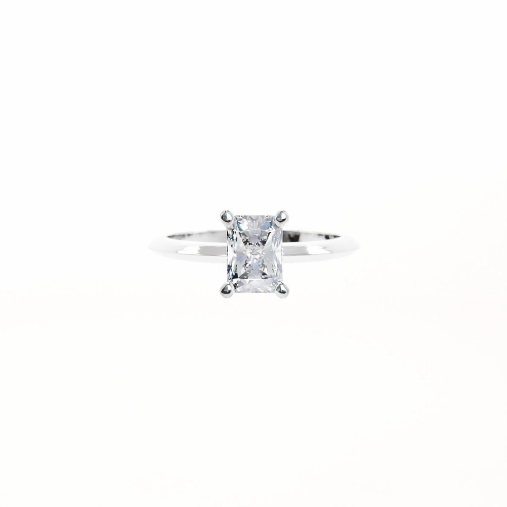Silver ring with a clear gemstone on a white background