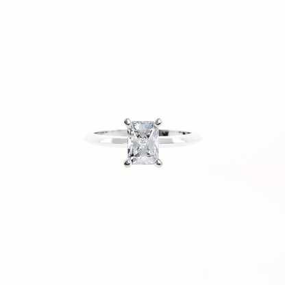 Silver ring with a clear gemstone on a white background