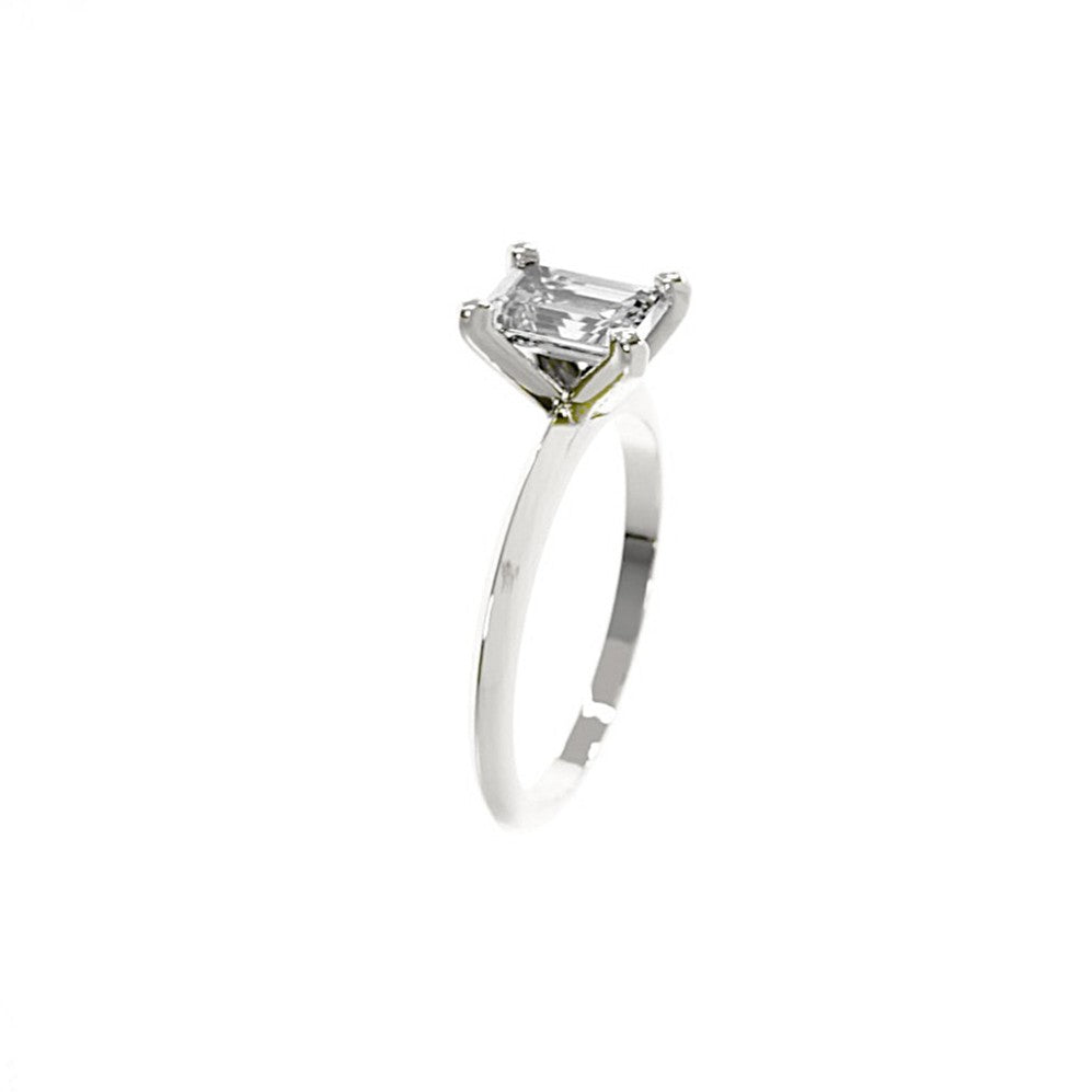 Silver ring with a diamond on a white background
