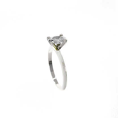 Silver ring with a large diamond on a white background
