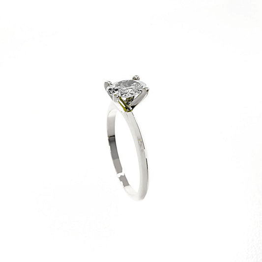 Silver ring with a large diamond on a white background