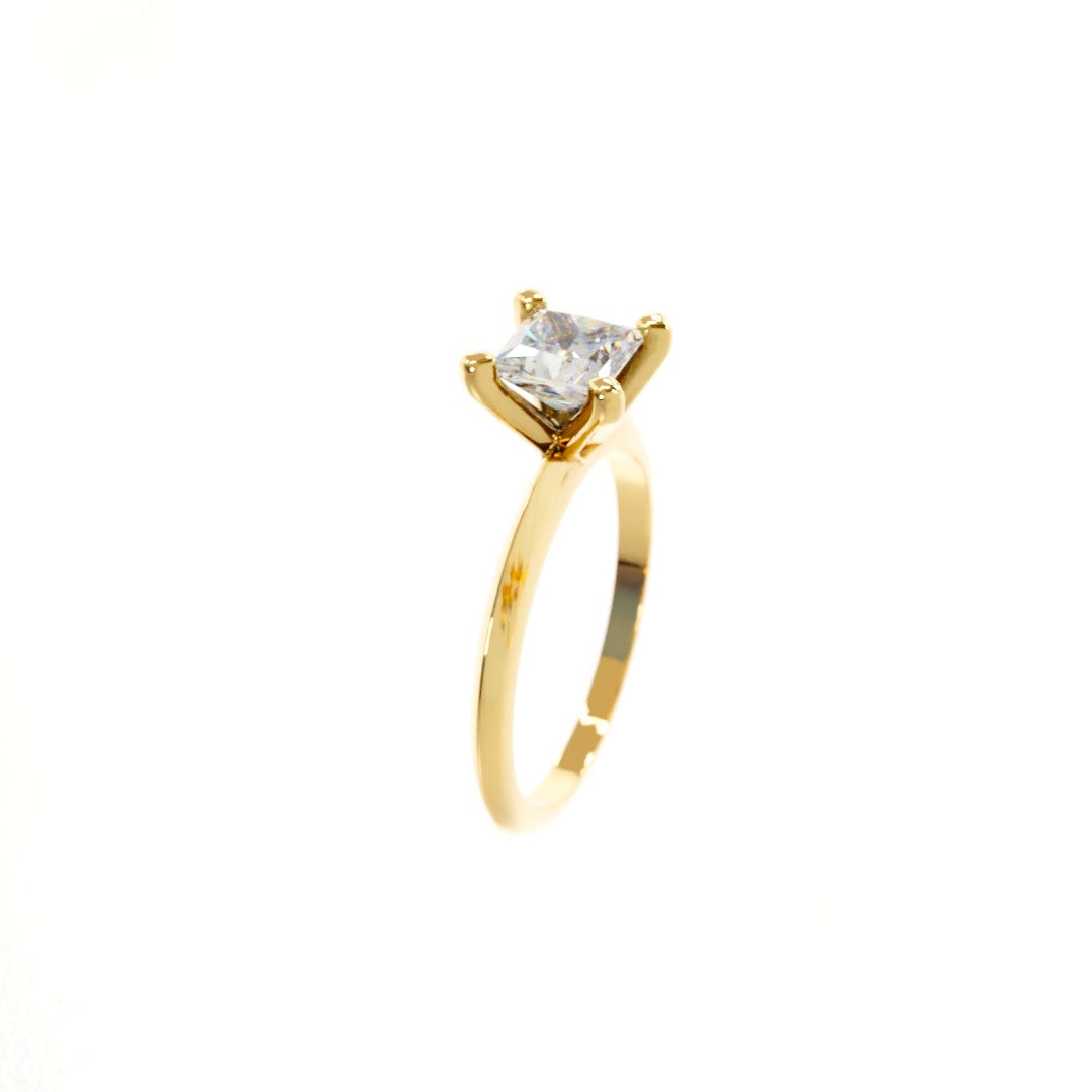 Gold ring with a clear gemstone on a white background