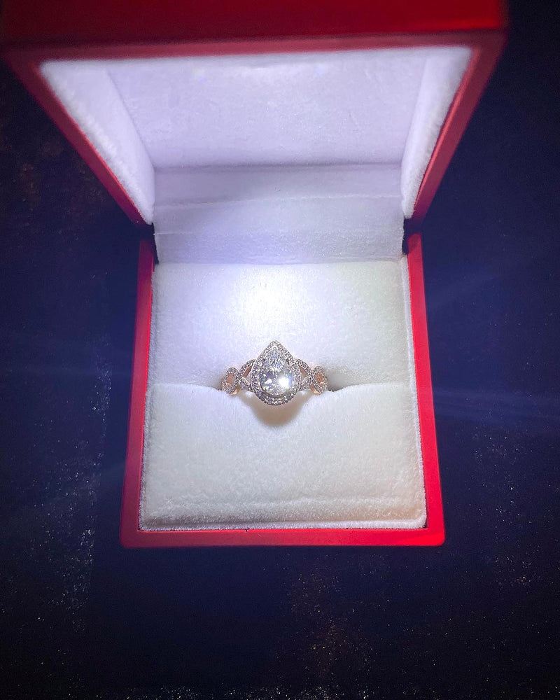 Diamond ring in a red box on a dark background