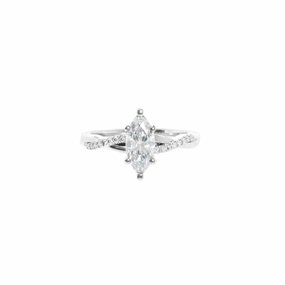 Diamond ring with a pear-shaped center stone on a white background