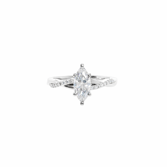 Diamond ring with a pear-shaped center stone on a white background
