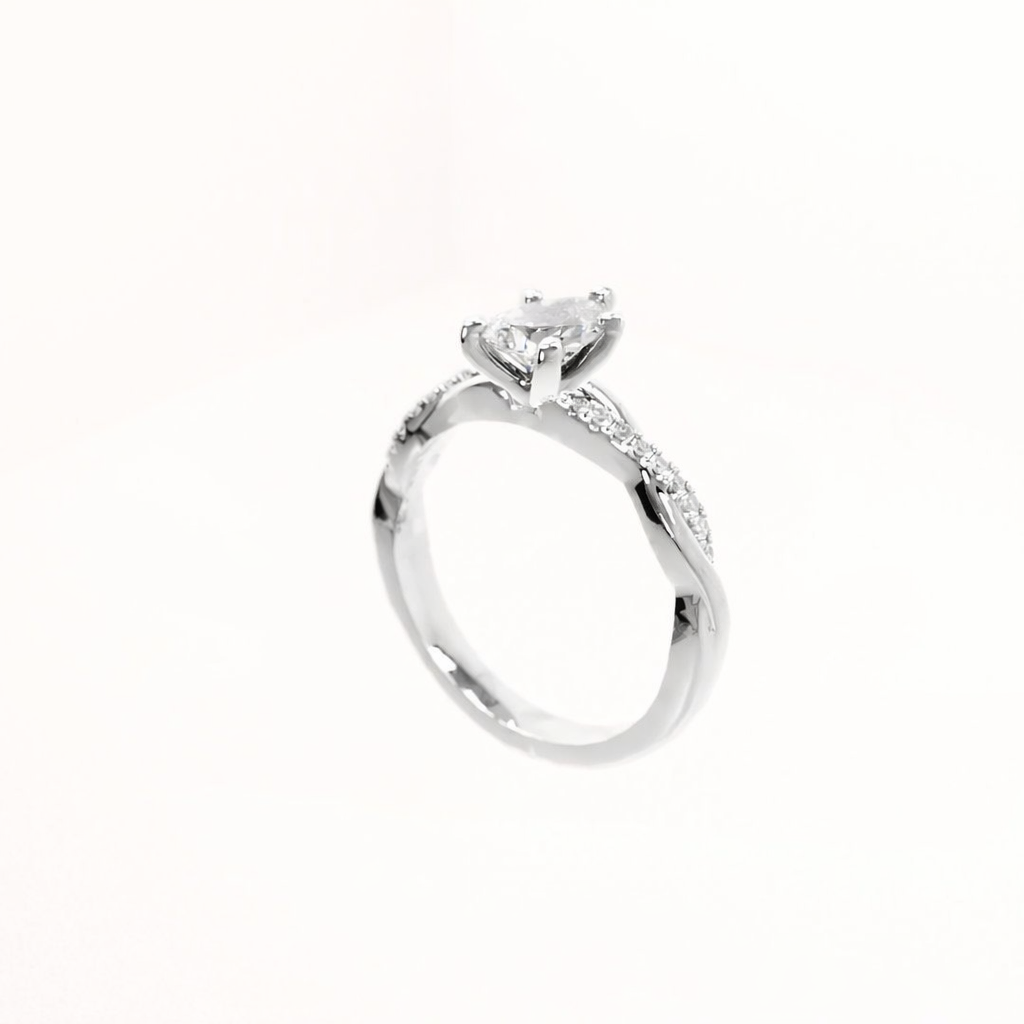 Silver ring with a diamond on a white background