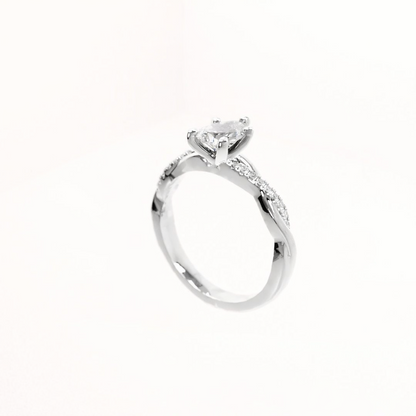 Silver ring with a diamond on a white background