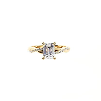 Gold ring with a diamond on a white background