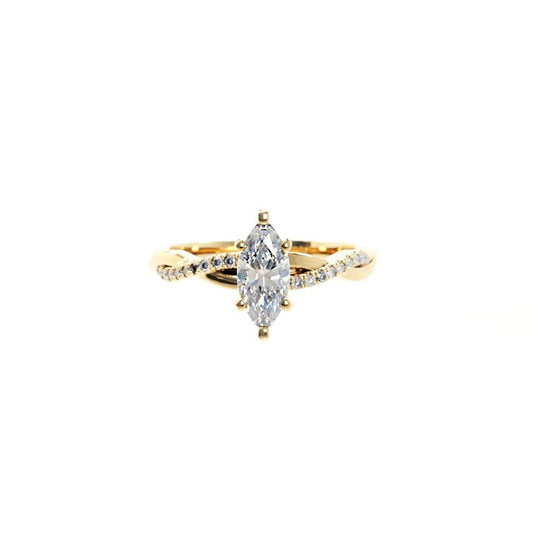 Gold ring with a large marquise-shaped diamond on a white background