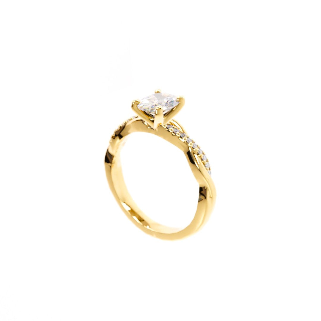 Gold ring with a diamond on a white background