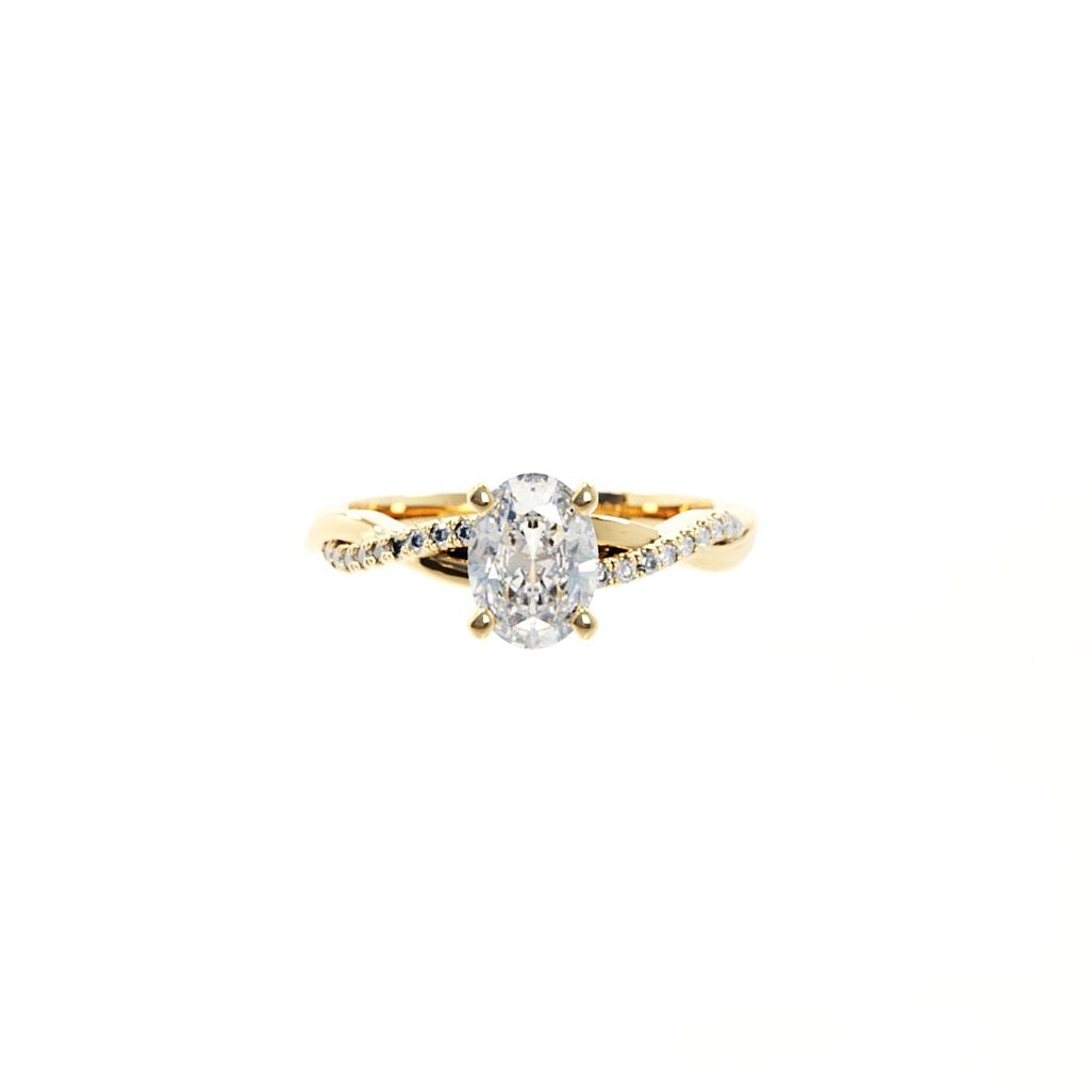 Gold ring with a diamond on a white background