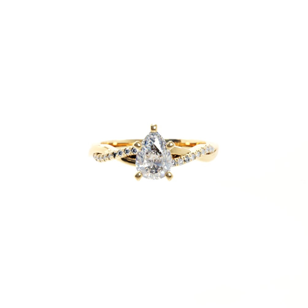 Gold ring with a diamond on a white background