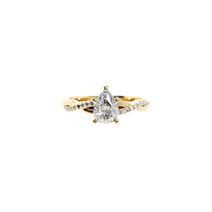 Gold ring with a diamond on a white background