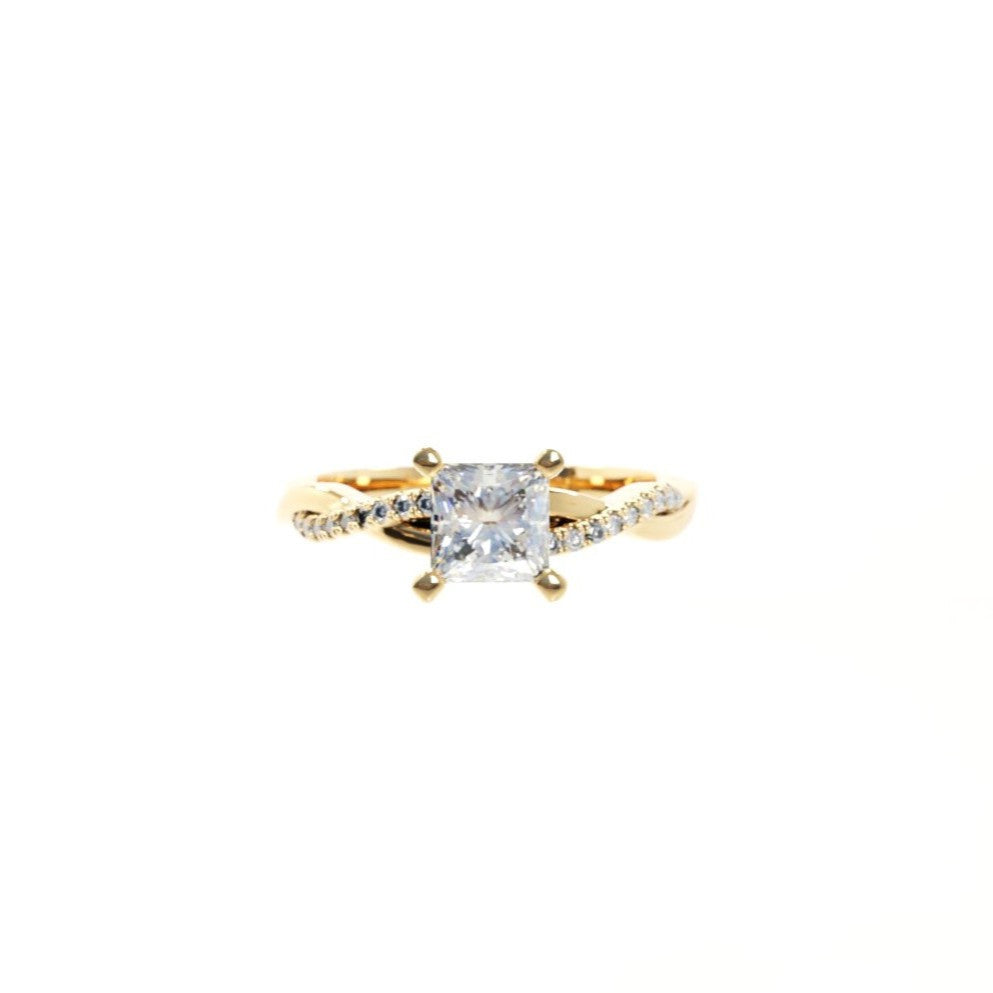 Gold ring with a diamond on a white background