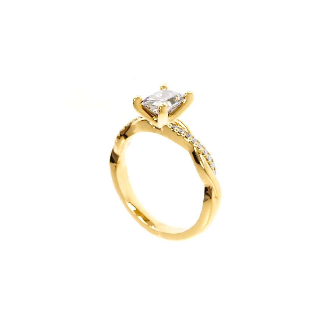 Gold ring with a diamond on a white background