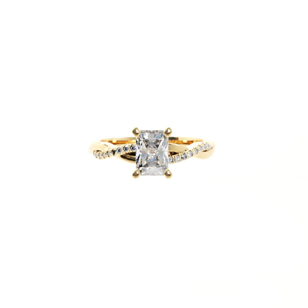 Gold ring with a large diamond and smaller diamonds on the band against a white background