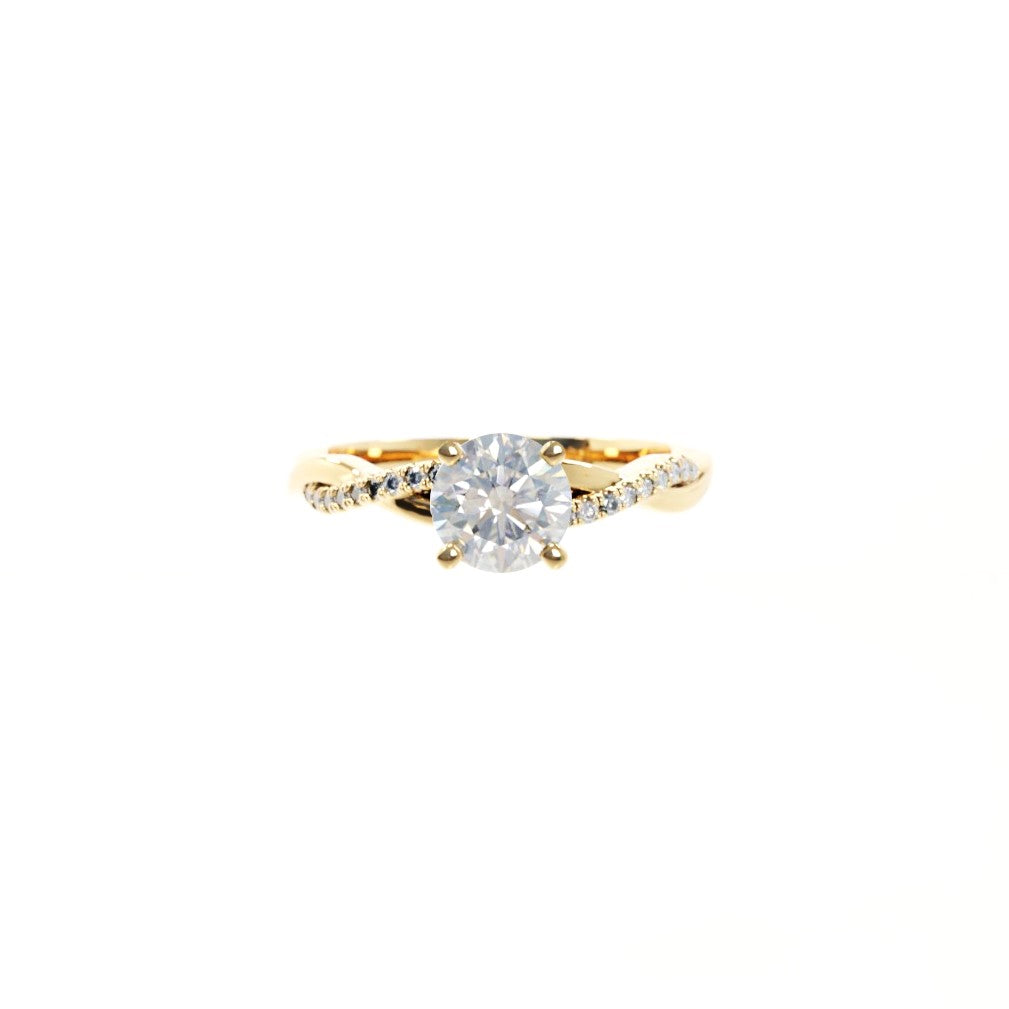 Gold ring with a diamond on a white background