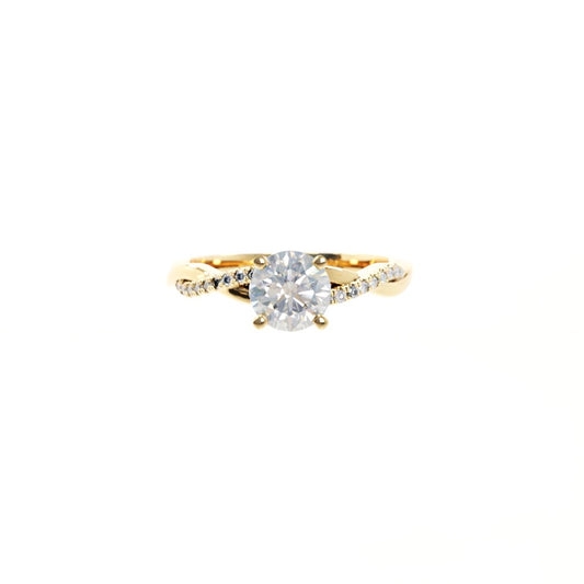 Gold ring with a diamond on a white background